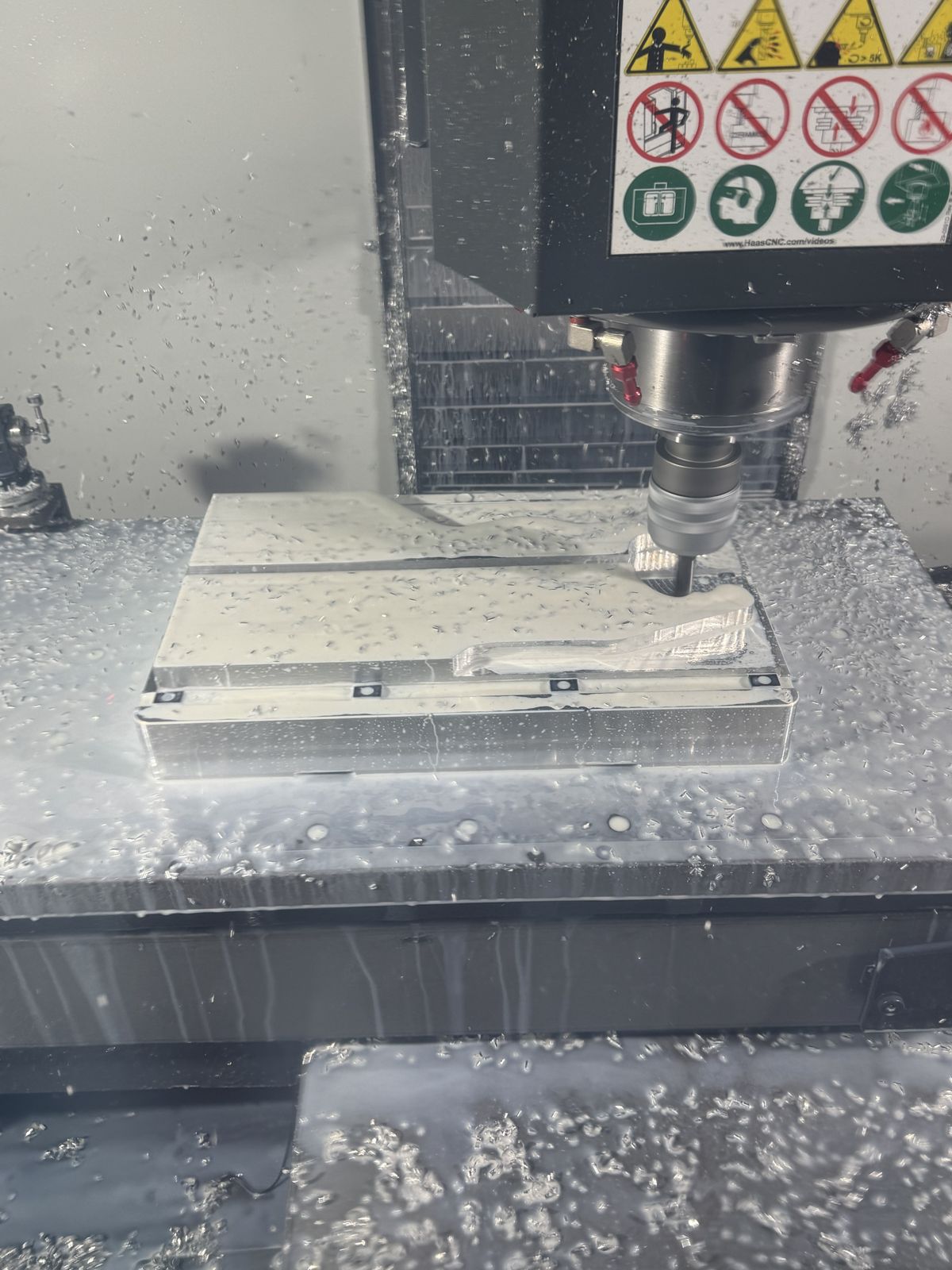 Haas mill cutting aluminum under flood coolant